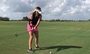 woman using the Right Angle 2 Golf Training Aid